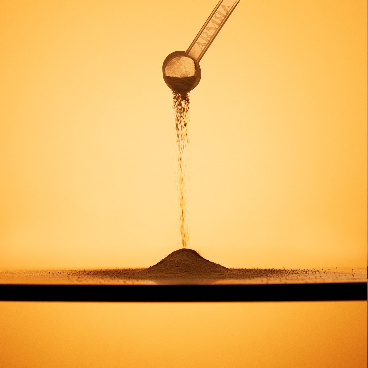 A scoop of ARMRA colostrum