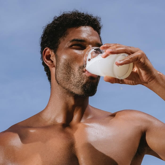 A man drinking ARMRA colostrum