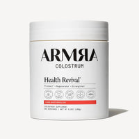 White cylindrical jar of ARMRA Colostrum with "Health Revival" and "Vine Watermelon" labeling, 6.3 oz, 90 servings.