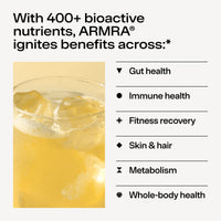 Glass of a yellowish liquid with text about ARMRA's benefits on a white background