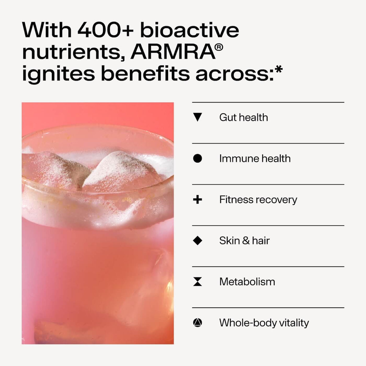 Glass of pink watermelon-colored beverage with ice cubes and product benefit text listed on right.
