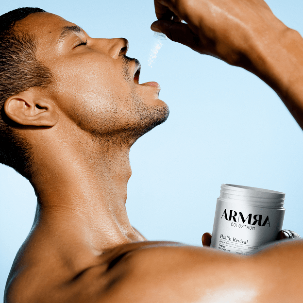 A man dry scooping ARMRA colostrum