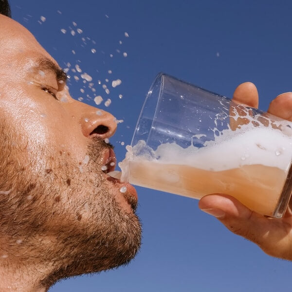 A man drinking ARMRA colostrum
