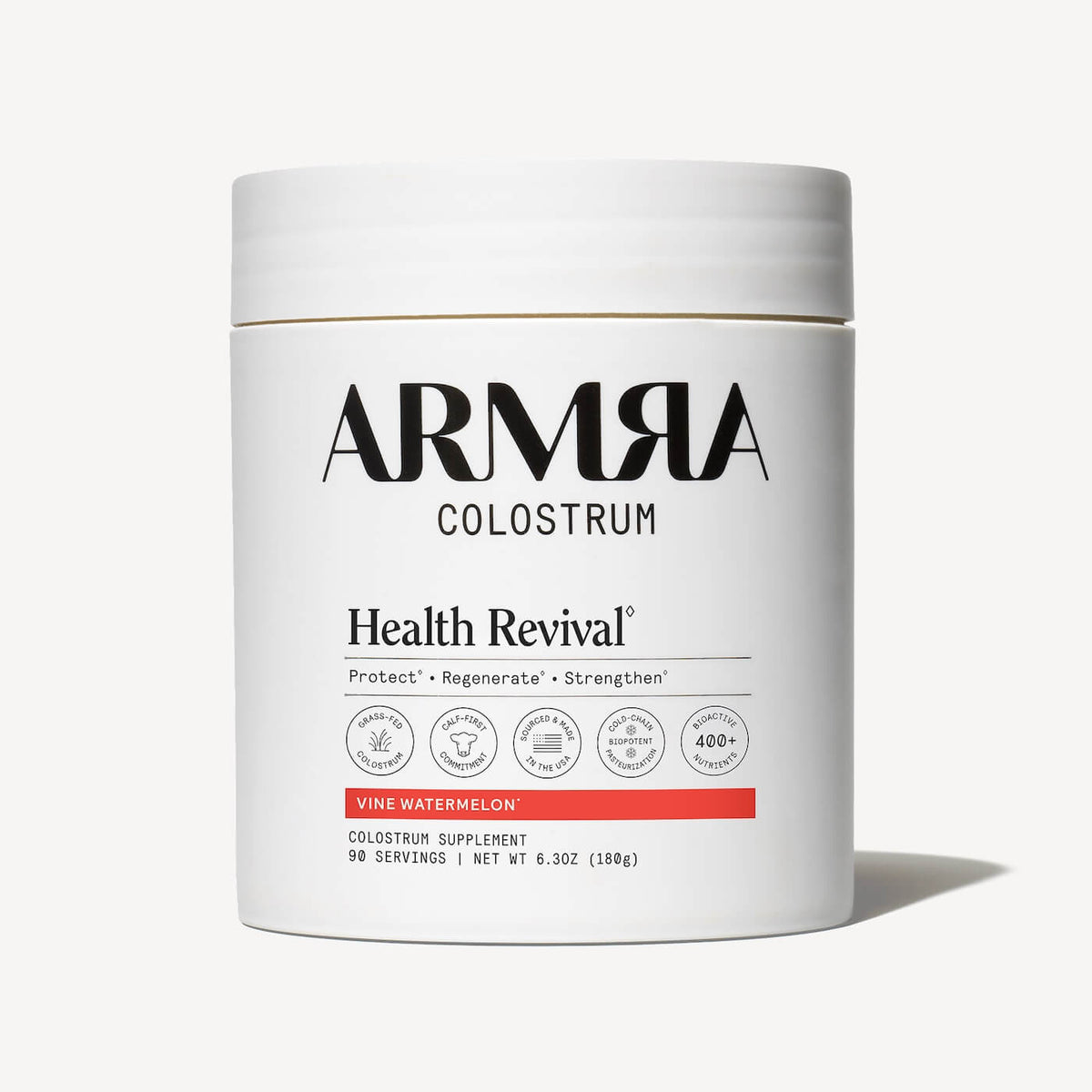 White cylindrical jar of ARMRA Colostrum with "Health Revival" and "Vine Watermelon" labeling, 6.3 oz, 90 servings.