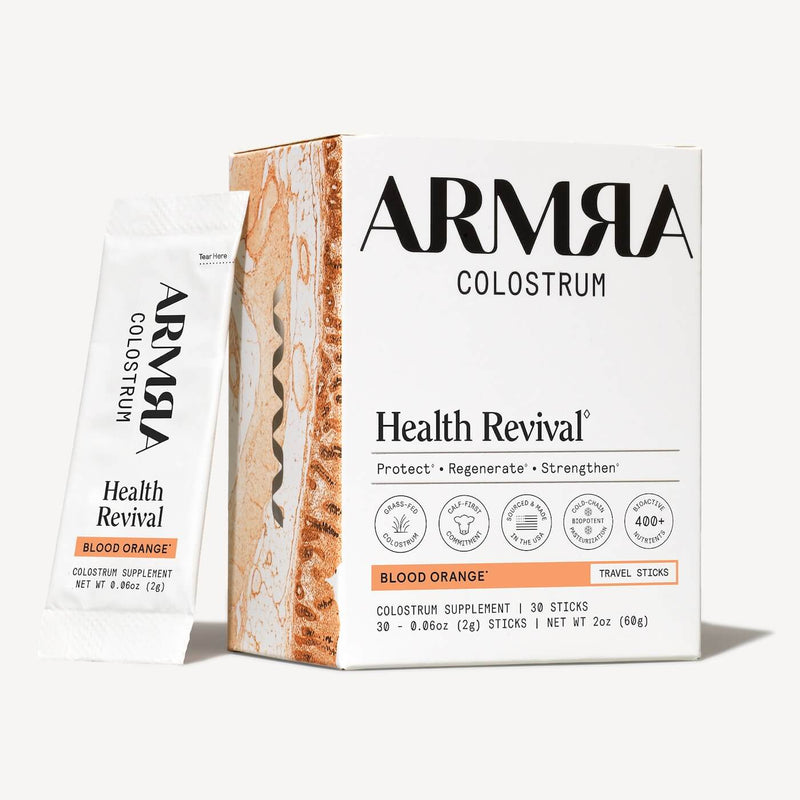 ARMRA Colostrum Health Revival Blood Orange travel sticks box with individual packet displayed beside it.