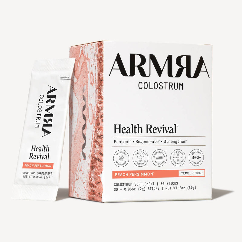 ARMRA Colostrum Health Revival travel sticks in peach persimmon flavor, 30-pack box with individual sachets displayed.