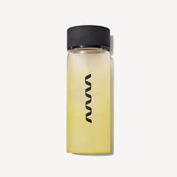 Clear glass carafe with black cap and ARMRA logo containing pale yellow liquid.
