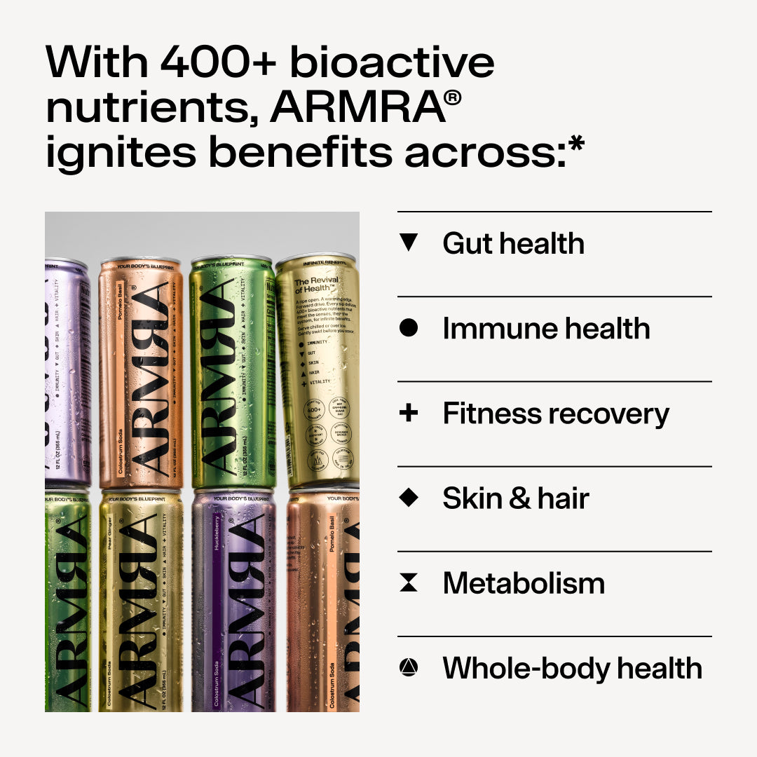 Eight ARMRA Colostrum Soda cans in assorted colors including purple, copper, green, and brown arranged in two rows.