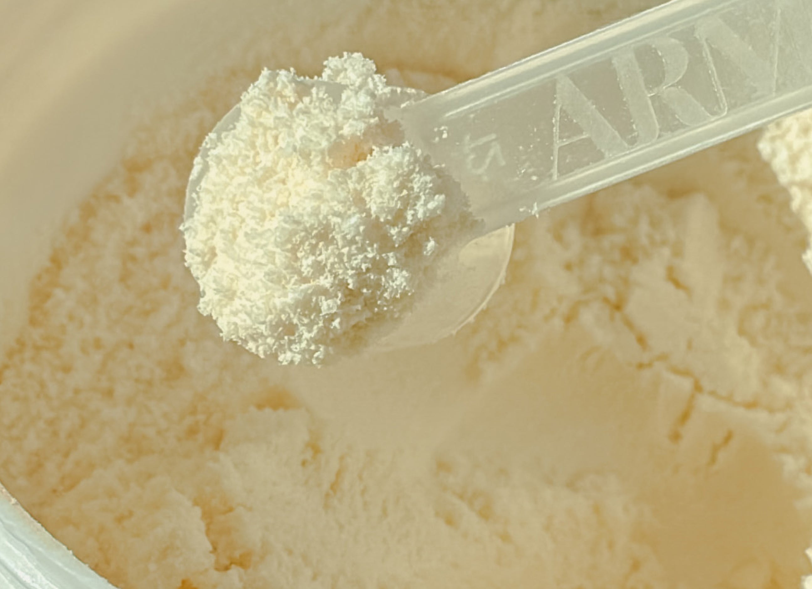 Scoop of ARMRA Colostrum Powder