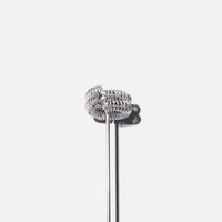 Silver whisk with spiral wire head and long thin handle on white background.
