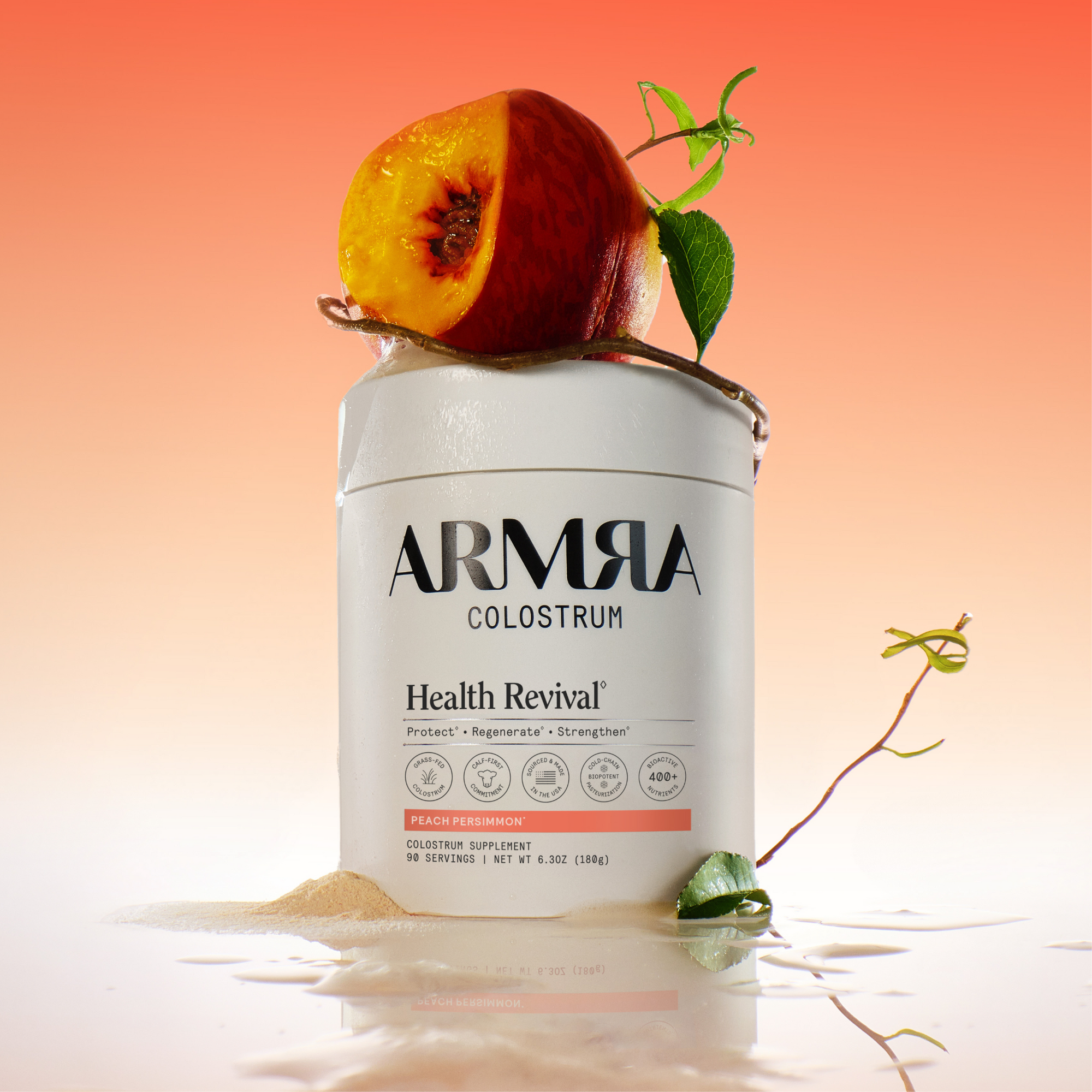A Jar of ARMRA colostrum peach persimmon with a peach on top.