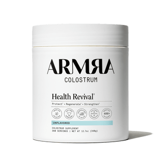 ARMRA Colostrum Health Revival supplement container on a black background