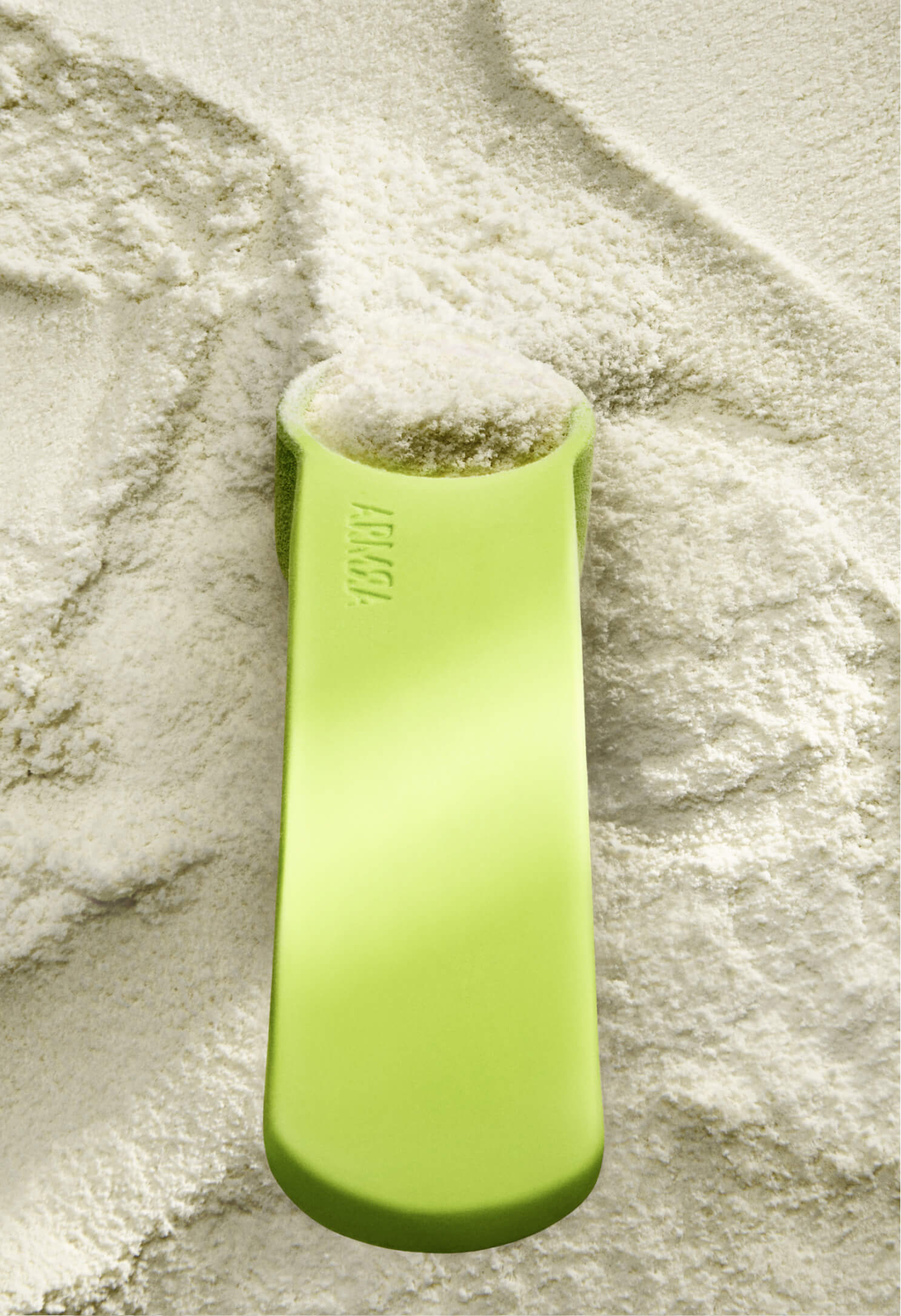 Green silicone sand scoop on colostrum