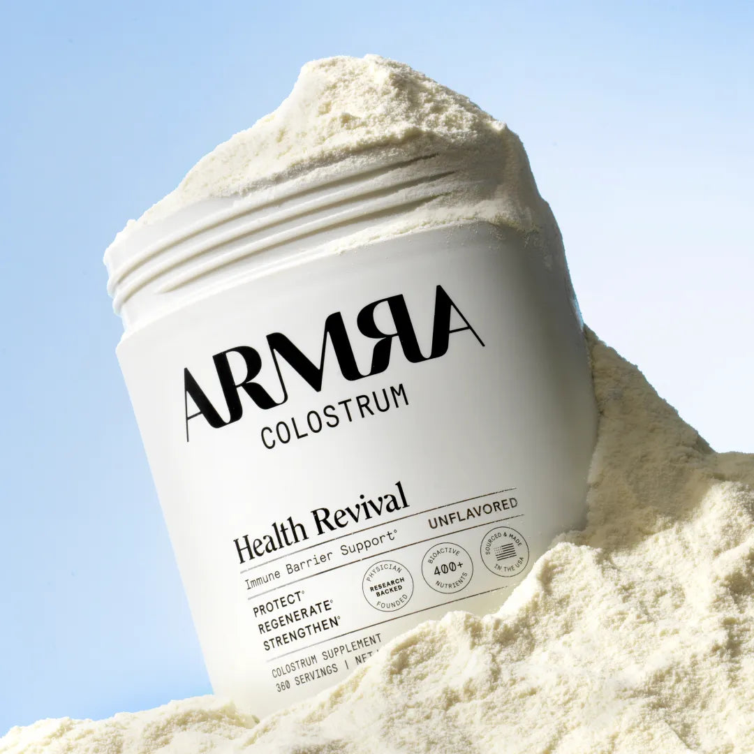 The Unflavored Jar in a pile of ARMRA colostrum. 